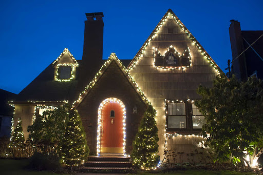 a home at night illuminated by Christmas lights